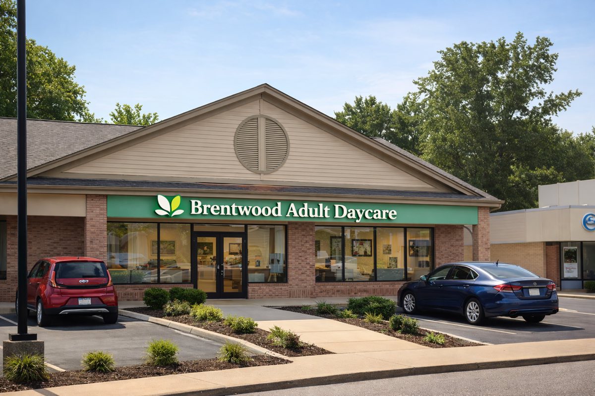A single-storey adult day care centre with a Brentwood Adult Daycare sign above the entrance, landscaped beds along the walkway and parking at the front.